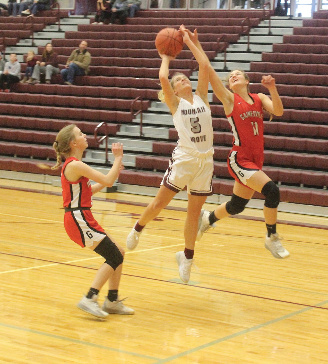 The Lady Panthers’ Campbell Welch goes up strong as she has her shot contested.